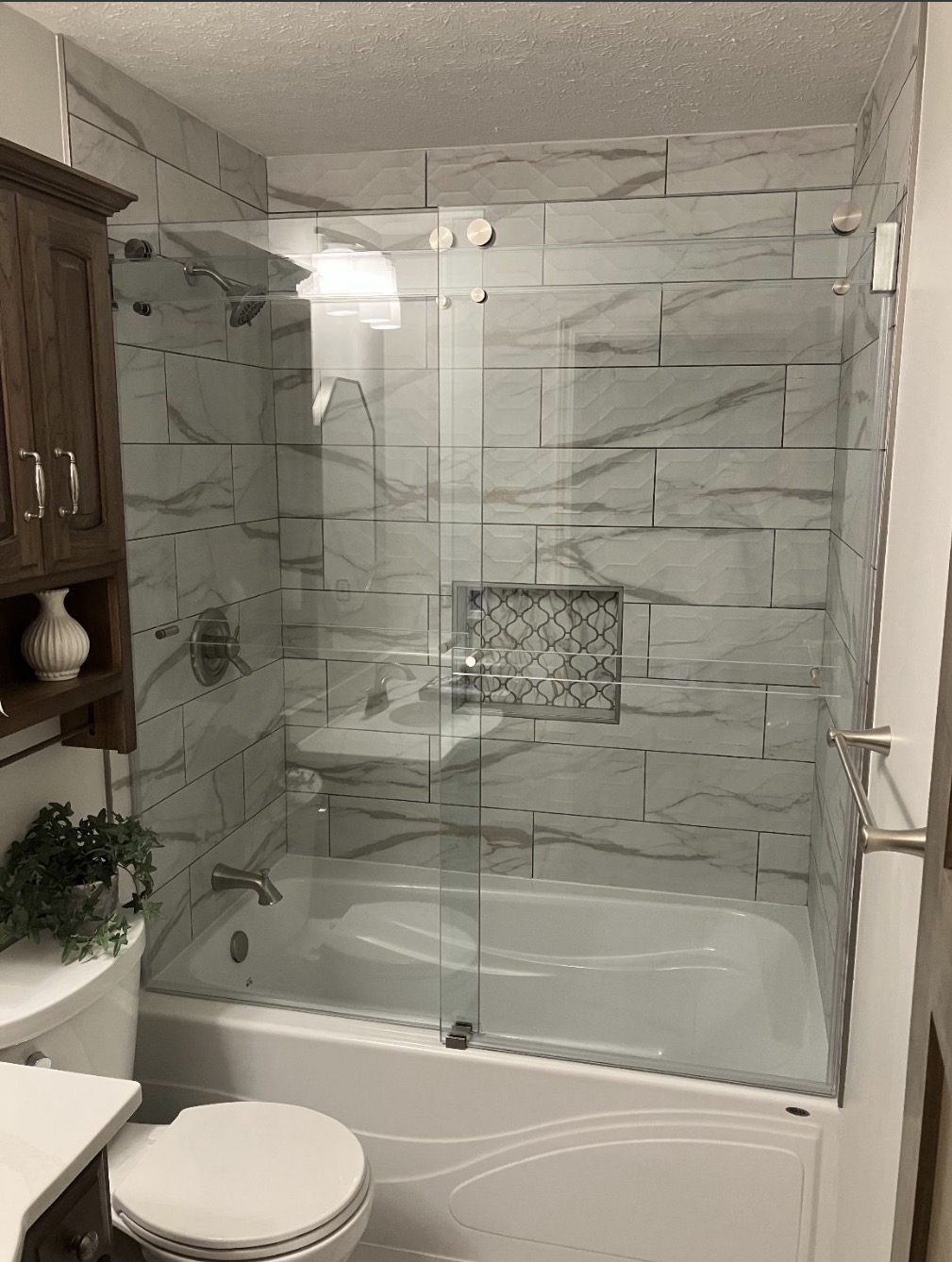 Frameless shower enclosure detail by Rob's Glass Repair